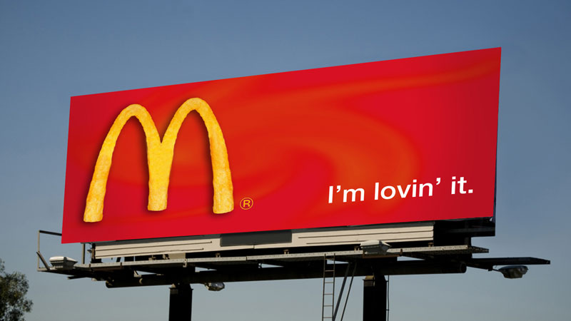 McDonald's marketing hook example with a red billboard with golden arches and a slogan saying 'I'm lovin' it.'